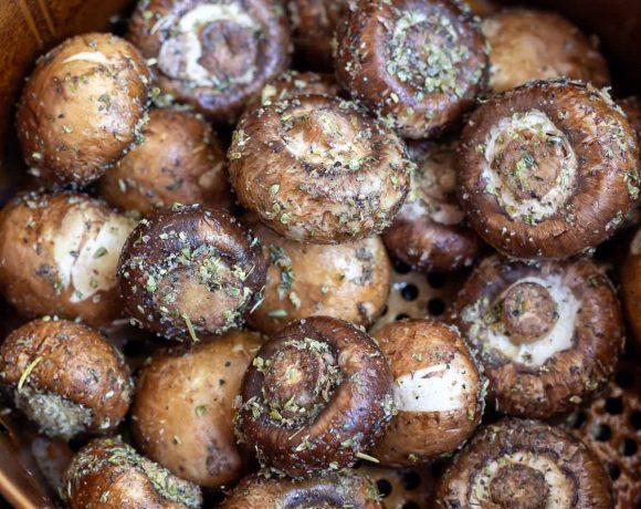 raw mushrooms in air fryer basket