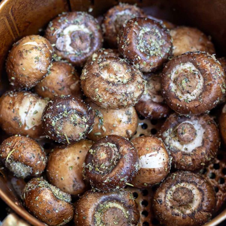 raw mushrooms in air fryer basket