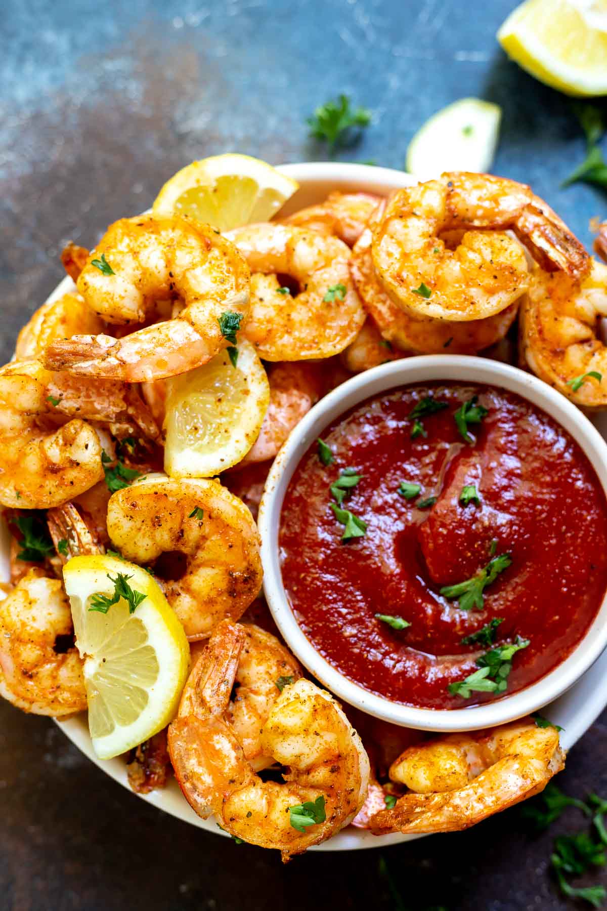 air fried shrimp with cocktail sauce and lemons