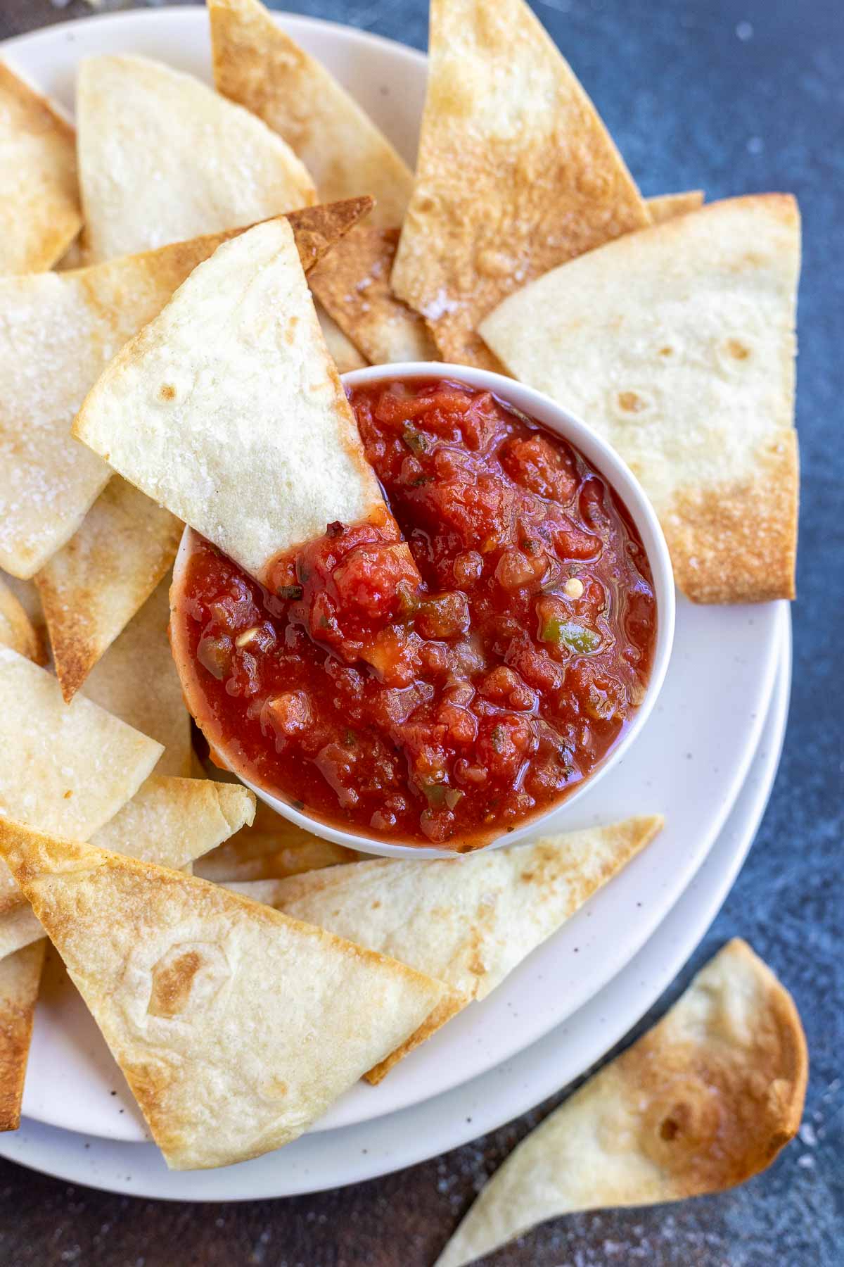 tortilla chips with salsa on white plate