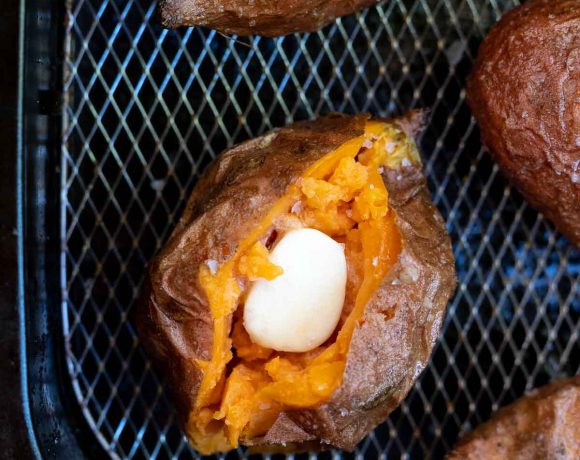 sweet potatoes filled with butter in air fryer basket