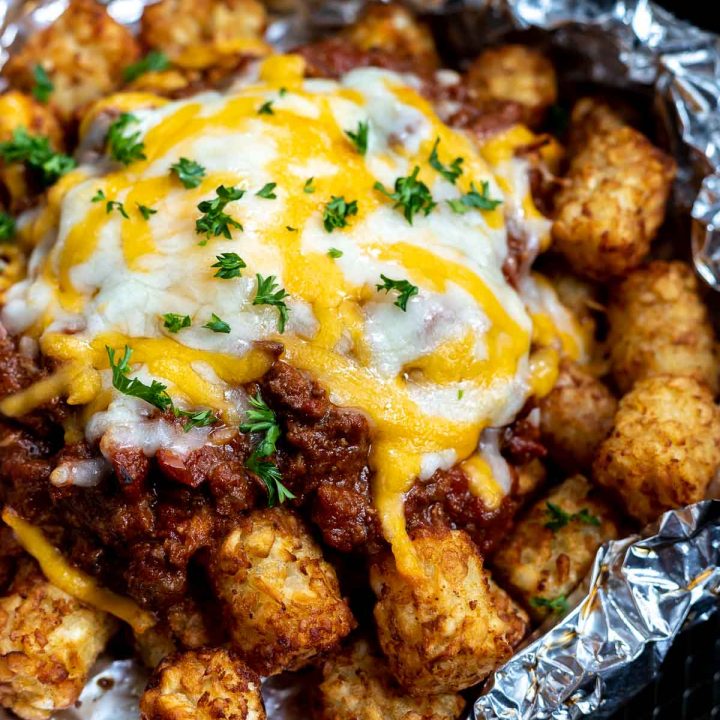 tater tots topped with chili and melted cheese
