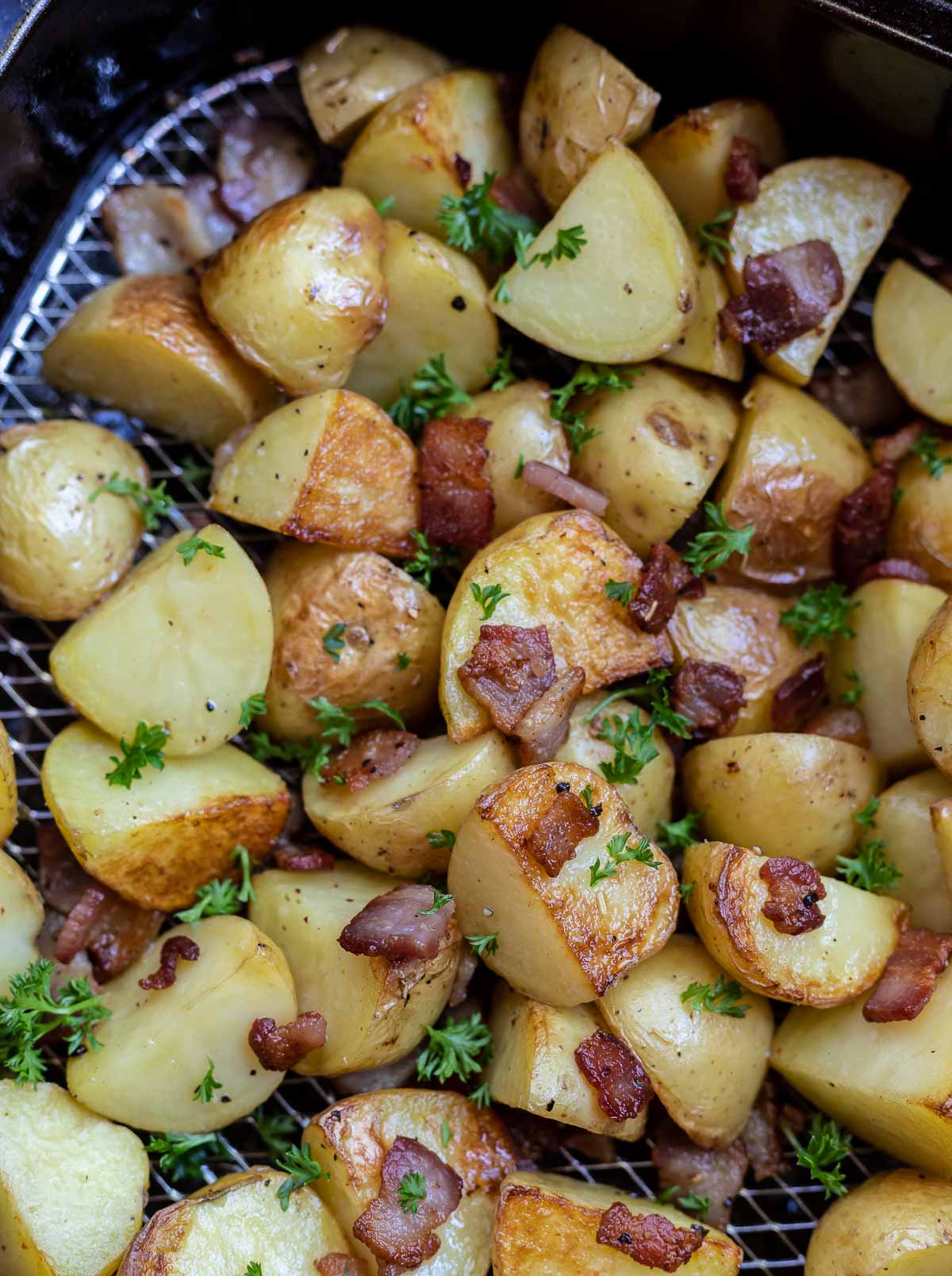 roasted potatoes and bacon in air fryer basket