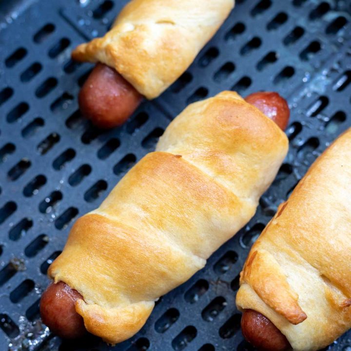 cooked crescent dogs in air fryer basket