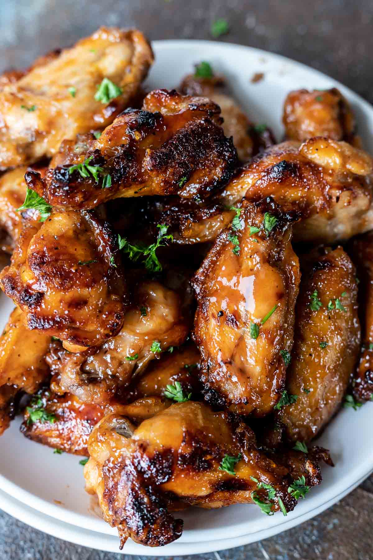 bbq chicken wings served on white plate
