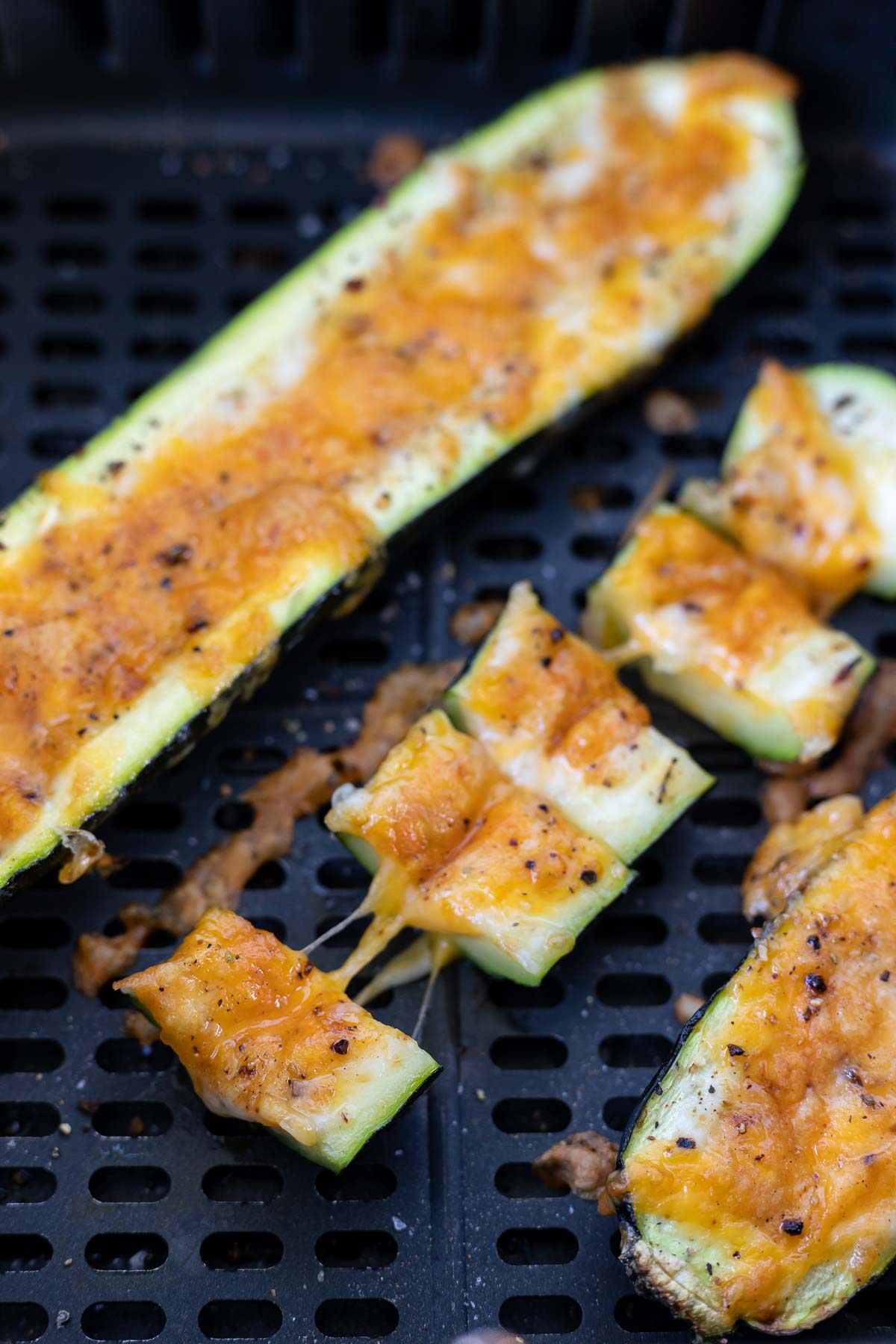 cooked cheese stuffed zucchini in air fryer basket