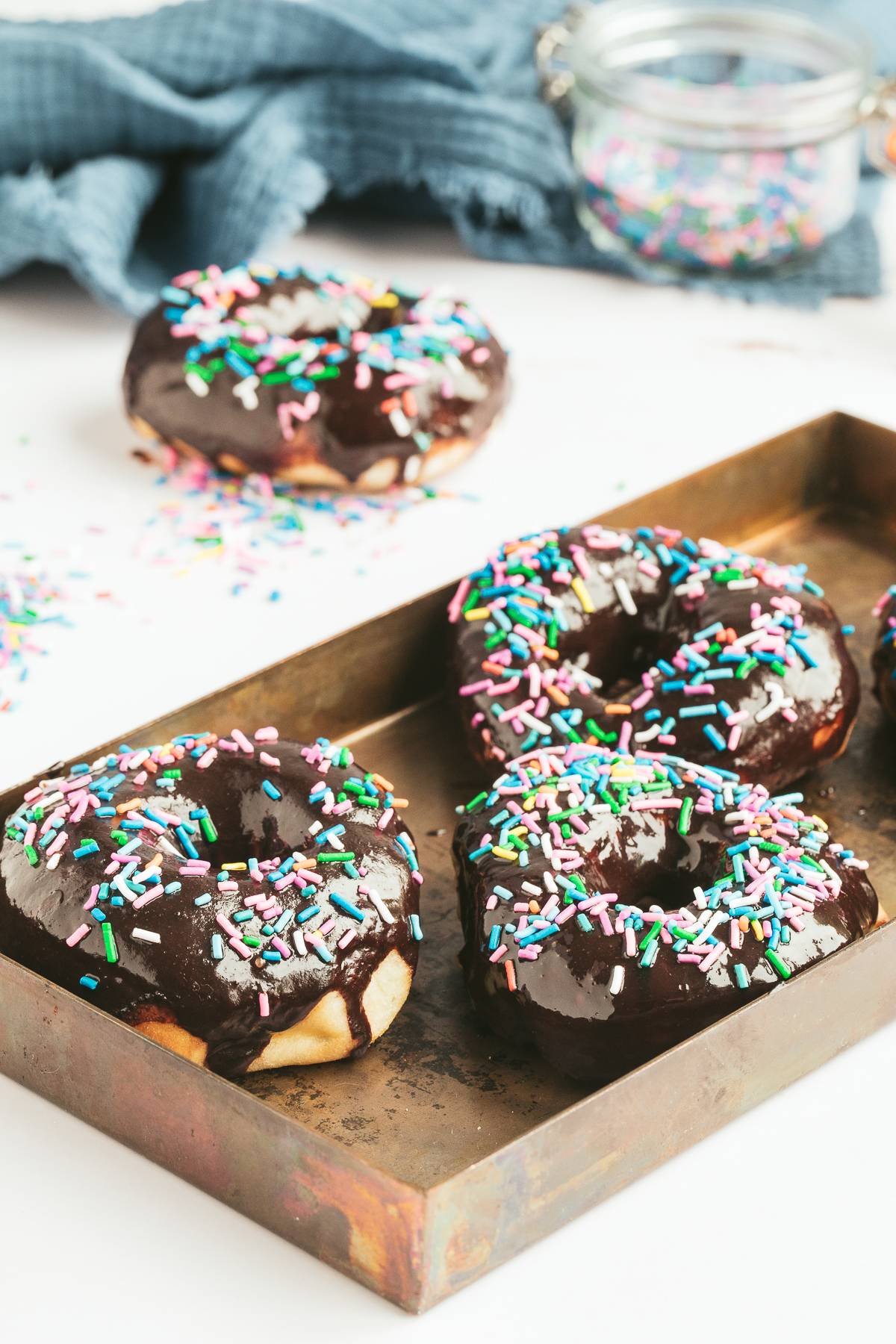 four chocolate glazed donuts